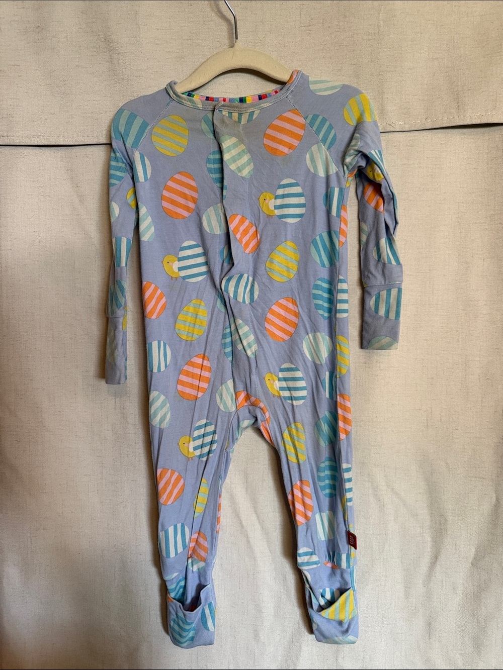 Magnetic Me Light Purple Footed One-Piece with Striped Egg Print runs large